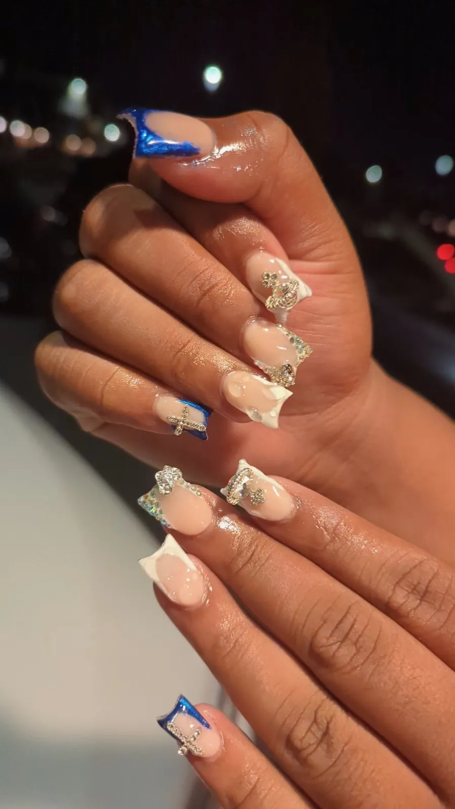 Nude nails with rhinestones and blue tips