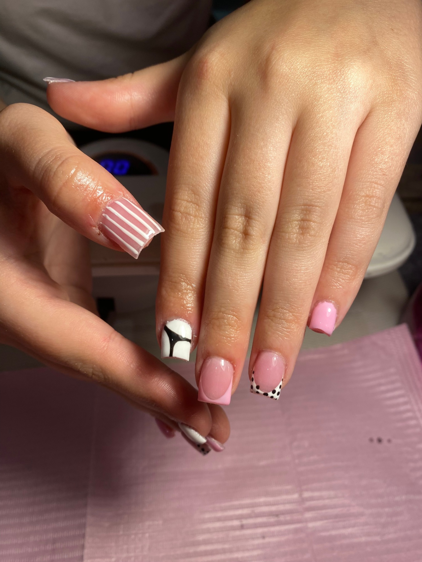 Pink and white acrylic set with polka dot art