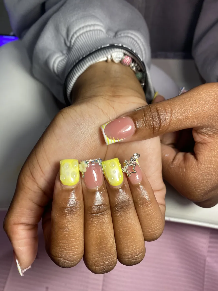 Yellow SpongeBob-inspired nail set with charms